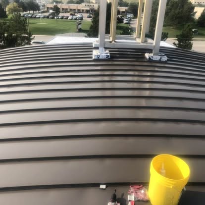 Curved barrel metal roof during installation