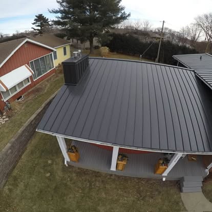Aerial view of a dark standing-seam metal roof